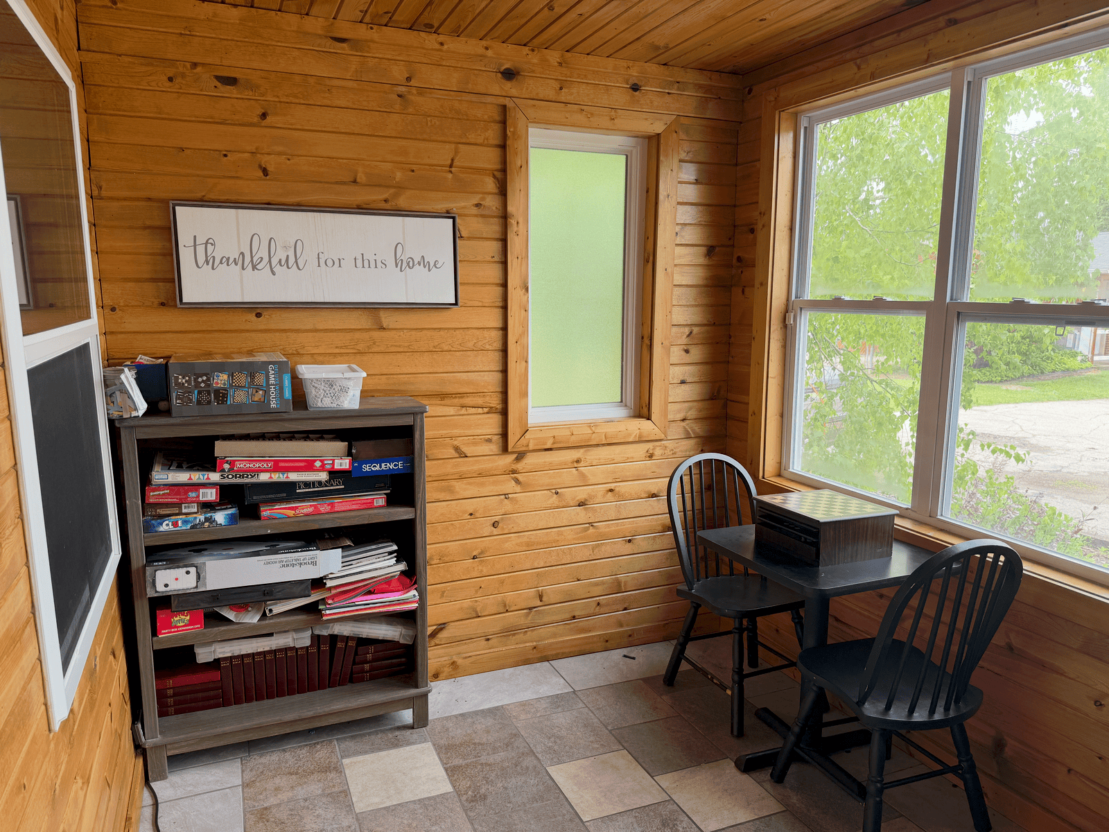 Three seasons room with table and community space